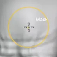 The Zculpt brush cursor over the mesh: the amber ring shown while masking, labelled Mask.